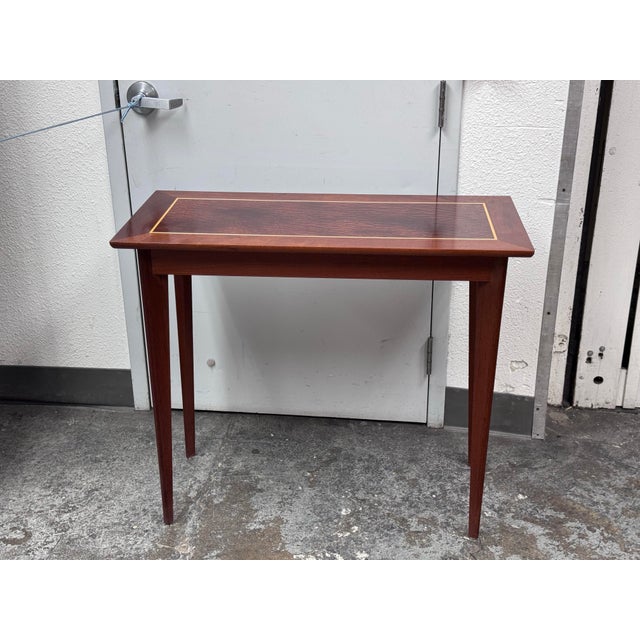 Design Plus Gallery presents a Custom Console Table from Trumblewood. This rectangular console balances warmth and...