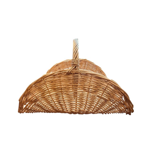 Handwoven wicker flower gathering basket, essential to the professional or amateur avid flower gatherer, with graceful...