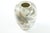 This elegant antique Chinese porcelain vase features a white cream base, beautifully decorated with bamboo and delicate...