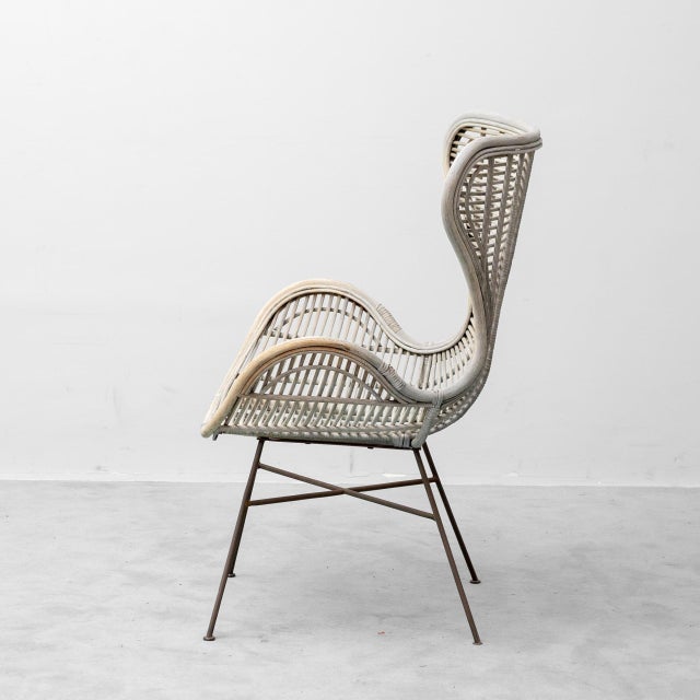Armchair made in the 1960s. Rattan seat and backrest, with metal legs. Good condition, as shown in the photos.