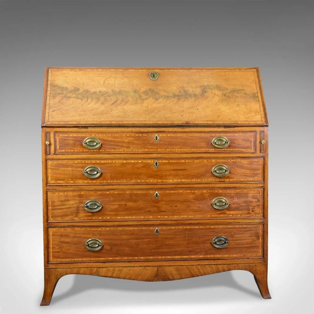 This is an antique bureau in light mahogany. An English, Georgian desk dating to the mid-18th century, circa 1770. Quality...