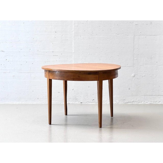 This round dining table, crafted from solid alder wood, combines timeless elegance with natural warmth and superior...