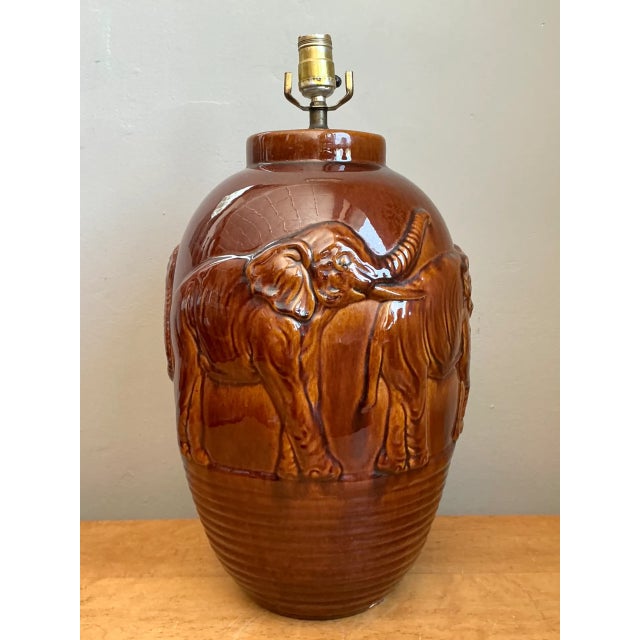 Molded with high-relief wildlife imagery and rich organic texture, this vintage ceramic table lamp features a continuous...