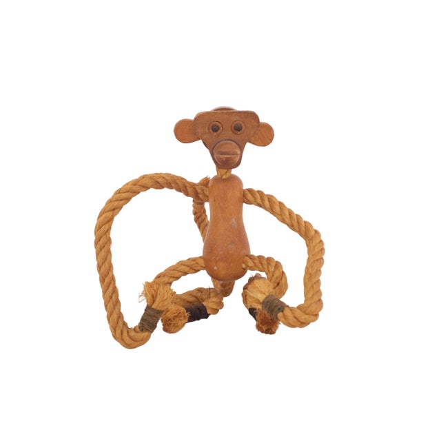 Mid-century wooden monkey figure with leather ears and rope arms and legs. Marked "Zoo Line Los Angeles Made in Japan"....
