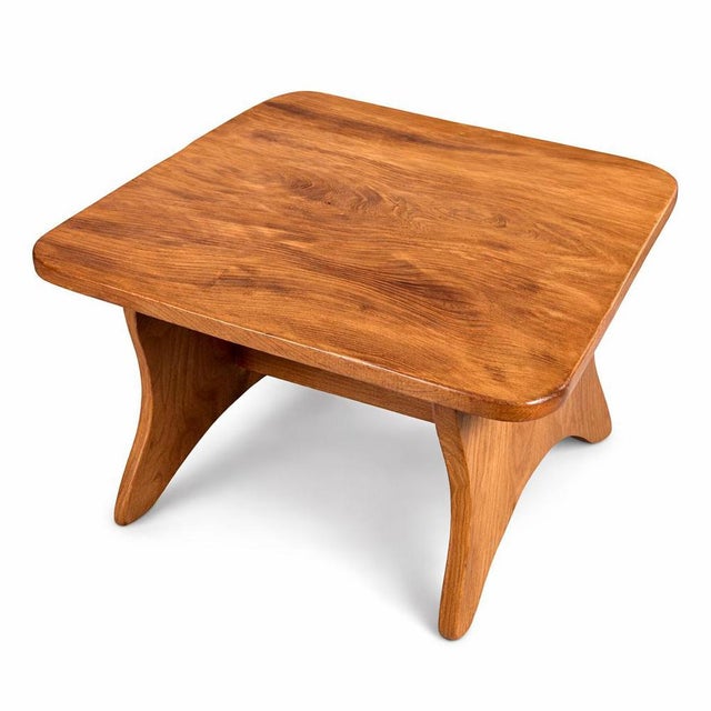 A beautifully crafted solid elm coffee table in the Arts & Crafts tradition, showcasing the warm tone and dramatic natural...