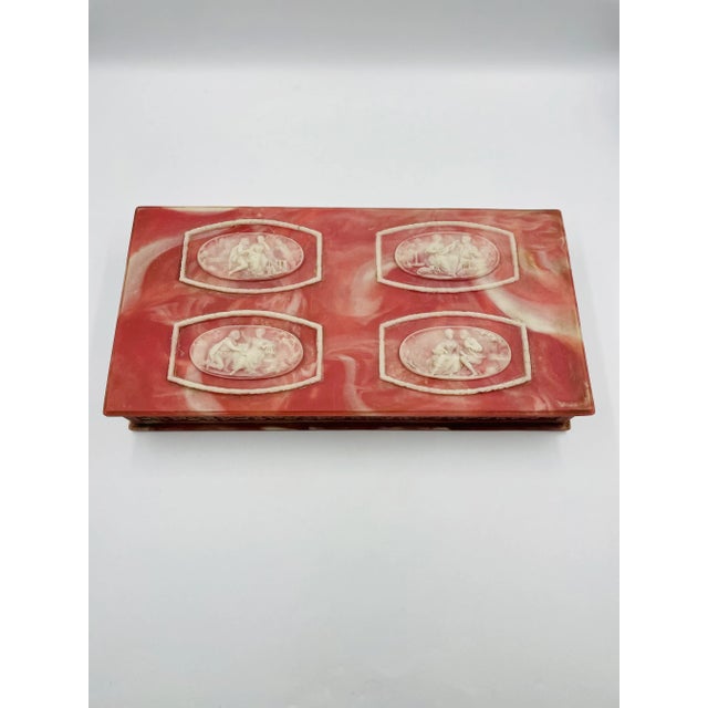 This Beautiful Incolay Stone Jewelry Box features a classical "courting couples" motif in a cameo-style relief. The large...