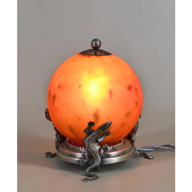 E. Val & Cie. and Charles Schneider A French 1925-1930 art deco night lamp in glass and silver plated brass. E. Val was a...