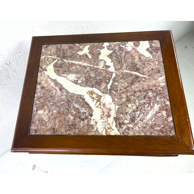 This is a hand carved Chinese walnut pedestal table. This pedestal has beautiful geometric carvings on all four sides with...