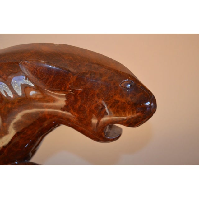 Sleek and powerful hand-carved panther fashioned out of Burlwood. A burl is a tree growth in which the grain has grown is...
