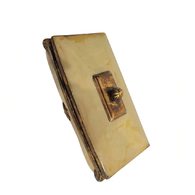 A beautiful and very unique all ceramic decorative storage box. The box features antique gold accents with a Fleur De Lis...