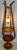 A central hanging fixture with an ornate frosted glass shade, typical of mid-20th-century Hollywood Regency and...