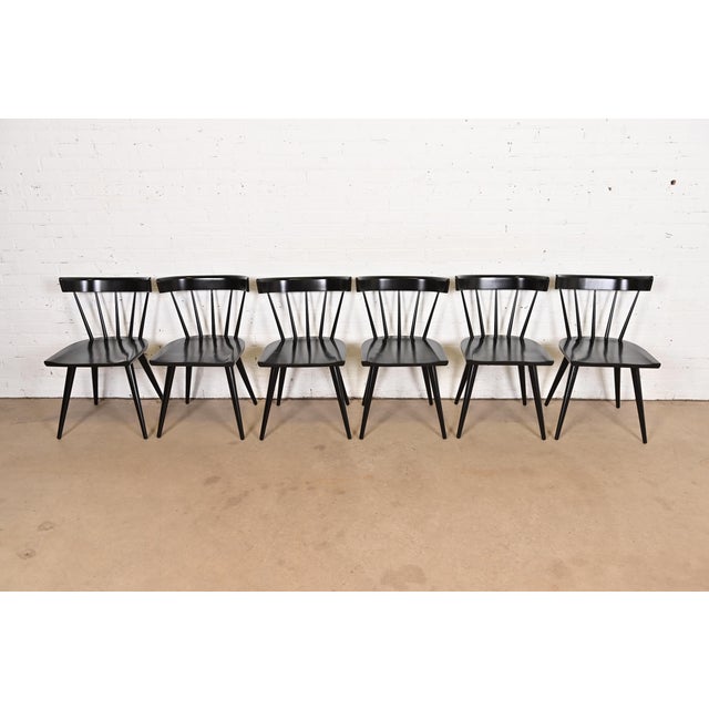 An exceptional set of six iconic mid-century modern spindle back dining chairs By Paul McCobb for Winchendon Furniture,...