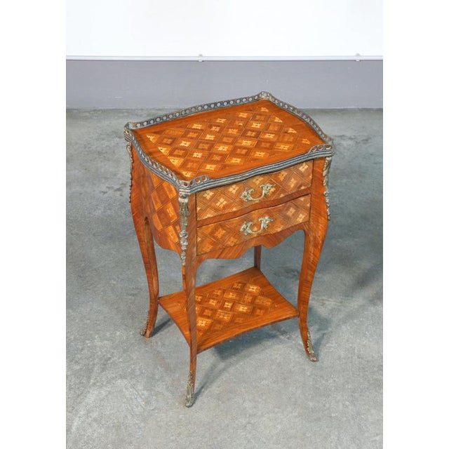 Napoleon iii bedside table in veneered and inlaid wood, with two drawers and a shelf at the base. 19th century period 19th...