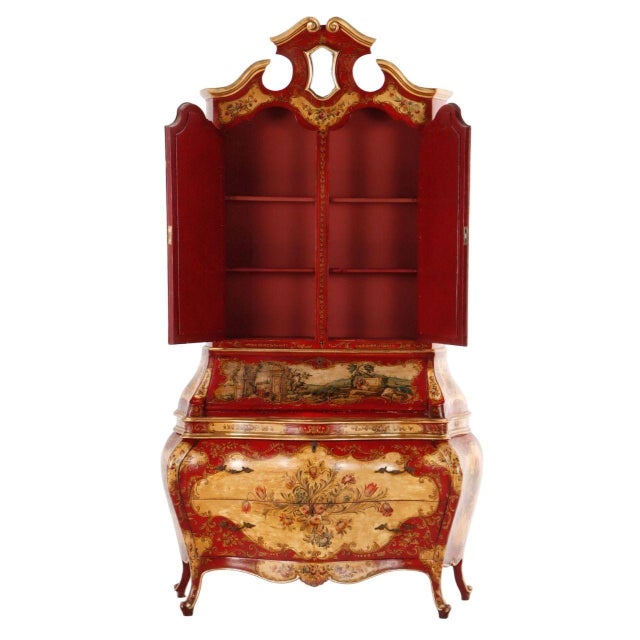 A striking two-piece Venetian secretary desk, beautifully hand-painted in classic red lacquer with gilt and floral...
