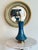 Standing at an impressive 34 inches tall (Grand / XL scale), this lamp features a striking, architectural hourglass/flared...
