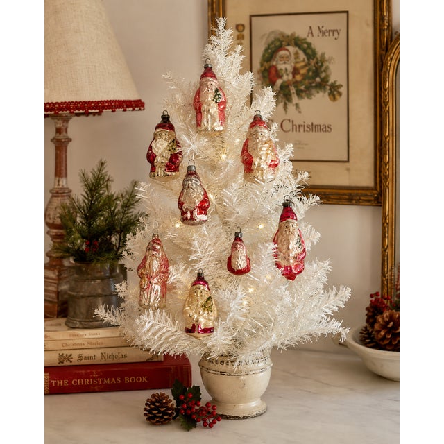Charming collection of eight antique German mercury glass Santa Claus Christmas ornaments dating from approximately...