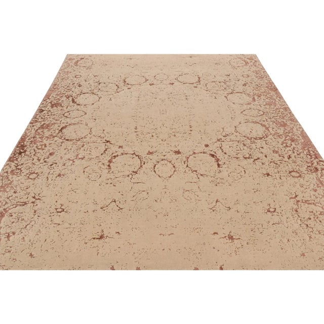 Hand-knotted in wool, this 8x10 modern classics rug from Turkey features beige-brown, peach and taupe tones underscore an...
