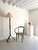 A French forged metal floor lamp with a tripod base and decorative scrolled feet. The barley twist details to the stem are...
