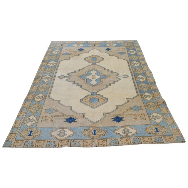 Hand-knotted with care using traditional rug-making techniques, this wool rug blends timeless craftsmanship with a modern...