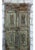 A striking piece of architectural salvage, this vintage single sliding barn door showcases intricately hand-carved...