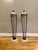 A Pair of floor lamps from the post modern era by American designer Michael Taylor, with travertine bases supporting a...