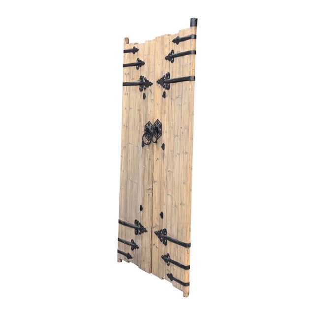 Embrace old-world character and authentic architectural history with this pair of antique rustic wooden double doors....