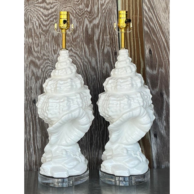 Bring the serene elegance of the seaside into your home with this exquisite pair of Vintage Coastal Glazed Ceramic Conch...