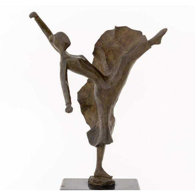 Tanya Poust (American, XX) Dancer Patinated Bronze Sculpture, signed "T. Poust" to circular base, atop a black marble...
