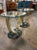 This product is a pair of vintage Art Deco brass and glass side tables, featuring elegant and classic design. These tables...