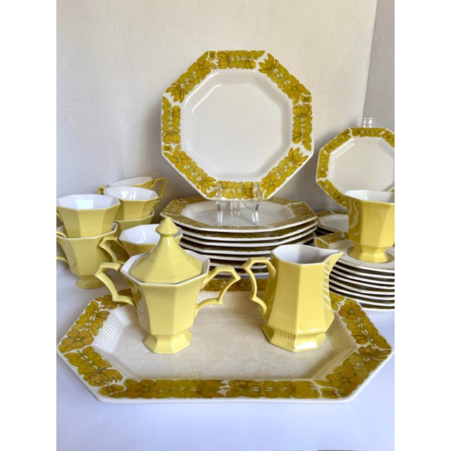 This is a vintage Independence Ironstone 43 piece dinnerware set in the "Yellow Bouquet" and "Yellow Daffodil" pattern,...