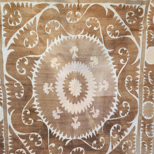 An amazing neutral blonde suzani from Uzbekistan. Covered in hand done embroidery. This piece took months of work to...