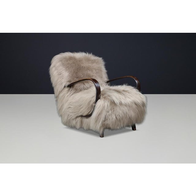 A striking and highly collectible Art Deco lounge chair by Jindřich Halabala, designed in the 1940s in former...