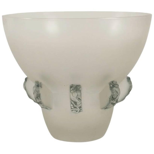 - Glass vase with motifs in high relief of birds seemingly supporting the top section - Glass highlighted with blue grey...
