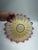 An elegant vintage art glass bowl featuring a striking pleated or starburst form with a dramatic ruffled, scalloped rim....