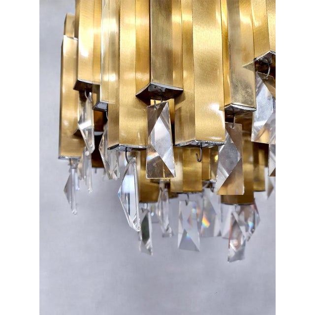 Has your eye fallen on this rare vintage design hanging lamp? This lamp is signed with Lumica in a brass pipe. Period:...