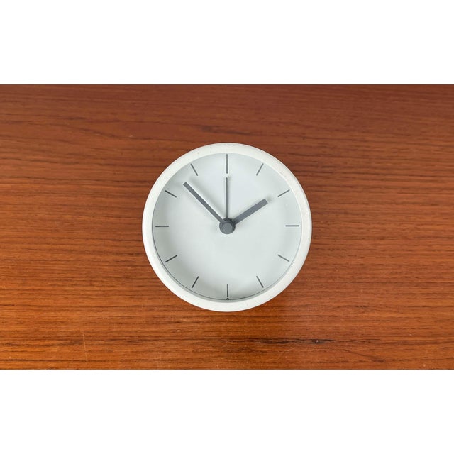 Minimalist alarm clock. To turn off the alarm, simply turn it upside down. This piece has an attribution mark, I am sure...