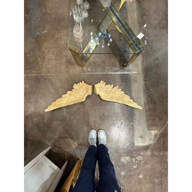 Beautiful pair of vintage Italian carved and giltwood wings. Adds an interesting design element. Very nice!