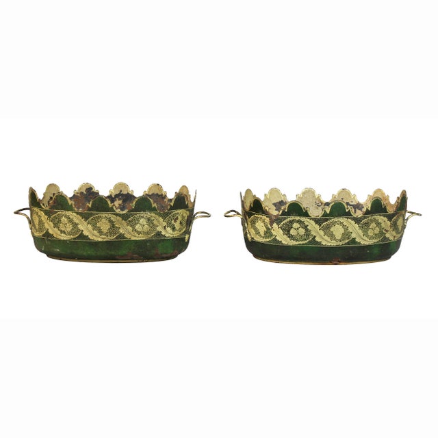 Each painted green with gilt rinceaux decoration. Oval form with loop handles.