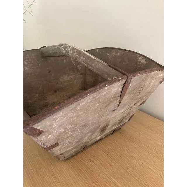 An Early Wood Basket with hand forged metal rims and fasteners. Great patina and very solid.
