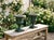 A pair of French green painted cast iron Medici style garden urn planters with green painted patina. Cast in two parts...