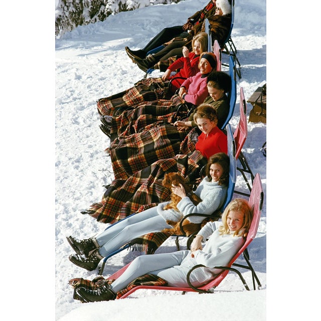 Apres Ski by Slim Aarons A group of women reclining on the snow in Gstaad with rugs covering their knees, 1963. (Photo by...