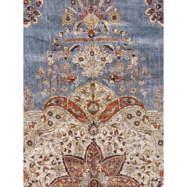 A vintage Turkish silk Herekeh carpet from the mid-20th century. Measures: 6' 9" x 10' 2"