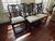 These elegant Baker Furniture pretzel-back dining chairs are crafted with solid mahogany. Known for the elegant curved...