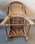 A vintage pair of Country style Burmese hand woven rattan lounge chairs from the mid 20th century, with looping, out...