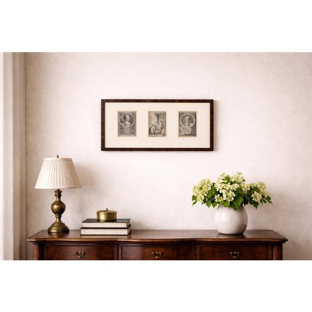 Three dutch historical engravings presented together under a cream mat in a single dark wooden frame. The subjects include...