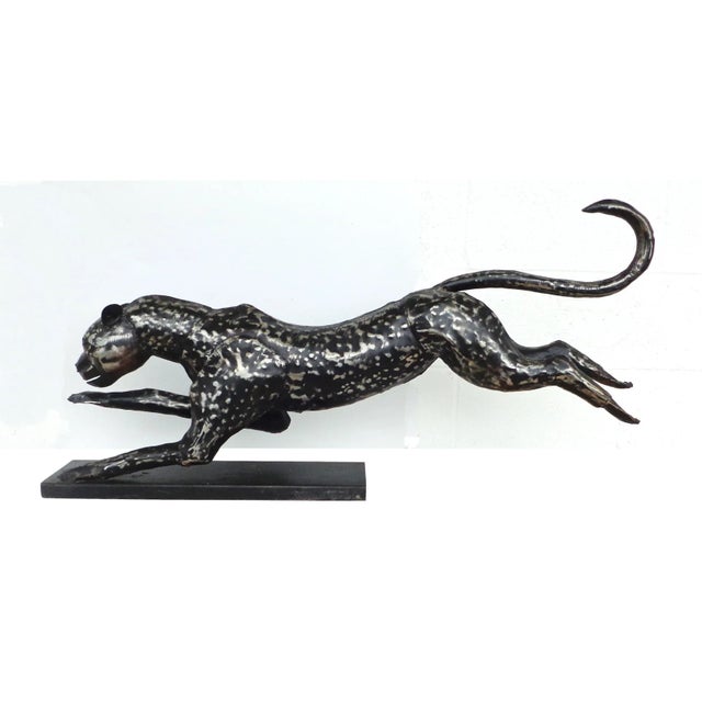 42″ Metal Cheetah In motion resting on base. Forged metal with ebony accents. 42″ W x 7.5″ D x 20″ H