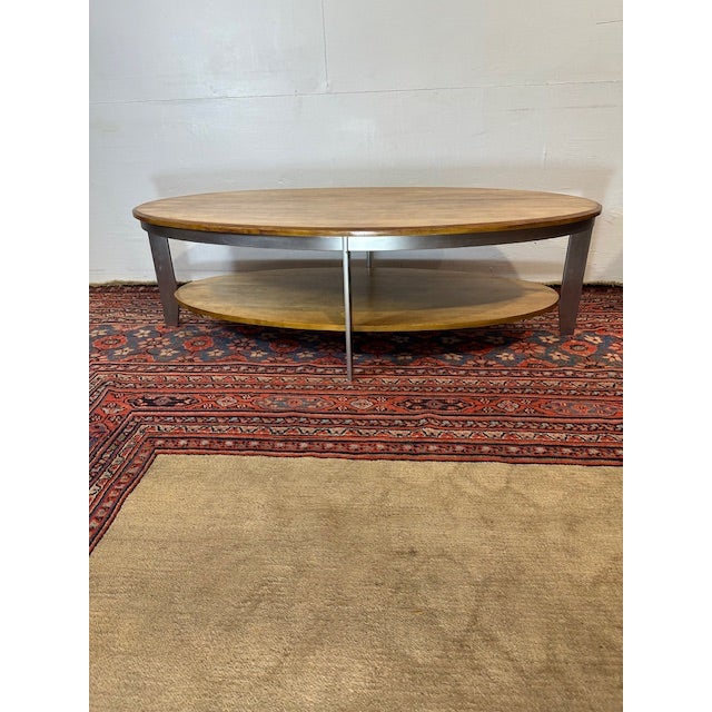 Introducing the Ethan Allen Cherry Wood Oval Coffee Table, a stunning blend of modern design and classic craftsmanship....