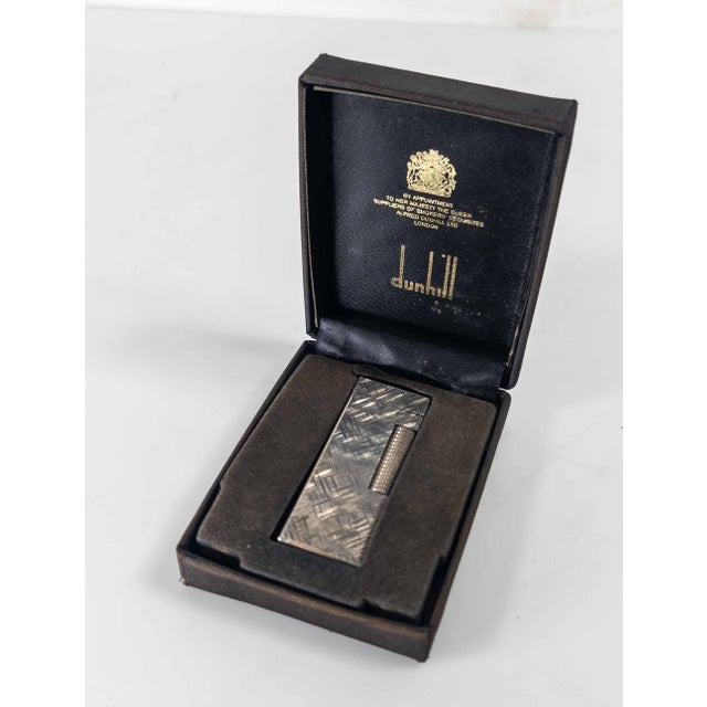 We are selling this great vintage cigarette lighter by Dunhill. This silverplate lighter is in Florentine pattern and...