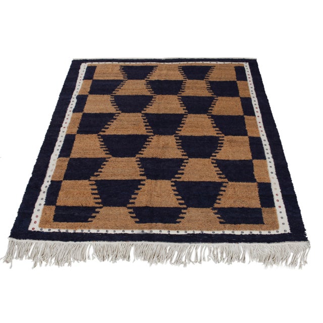 A specimen of artistic acumen, this Tulu rug of the 1950s from our Antique & Vintage collection unveils sharp geometry in...