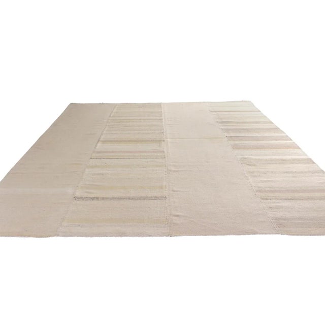 Hand woven in wool originating from Turkey circa 1950-1960, this mid-century flatweave hails from a distinct family of...